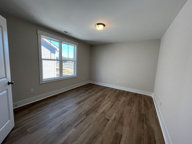 Spacious, unfurnished interior of a new home in River Tide Farms, Bolivia (Image 22).