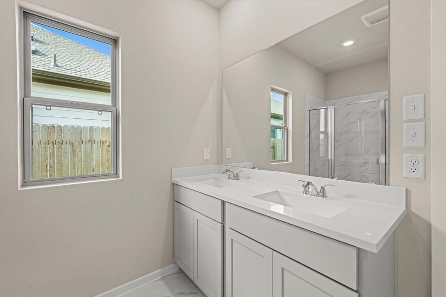 Primary Bath retreat with dual vanities & walk-in shower Primary Bath retreat with dual vanities & walk-in shower