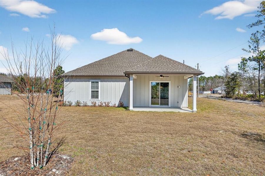 Exterior details and patio area of a home in Stables at Cary Forest, Bryceville (Image 26).