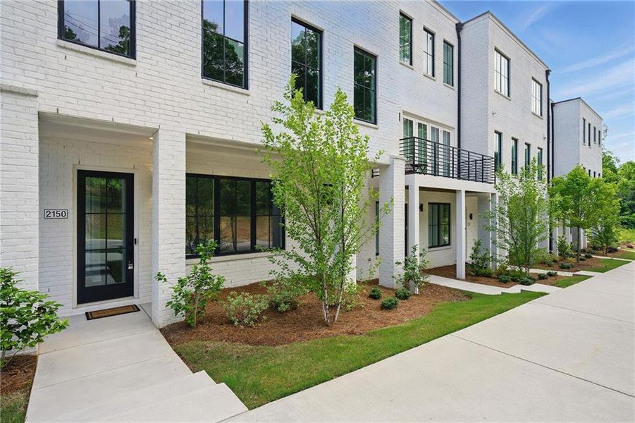 Front exterior of a new home in , Atlanta, GA, highlighting curb appeal (Image 24).