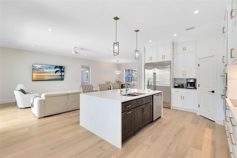 A view from the breakfast nook into the kitchen and living room.