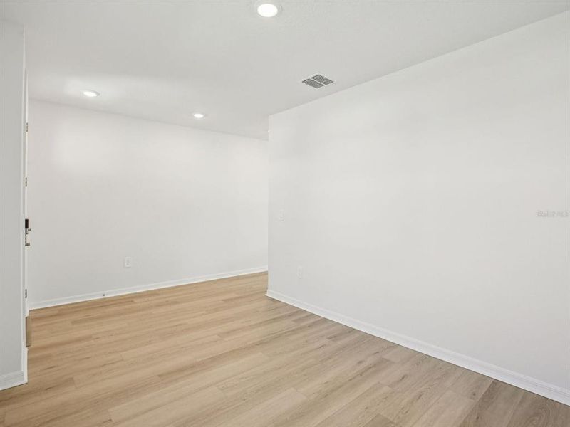 Spacious, unfurnished interior of a new home in The Grove at Stuart Crossing - Classic Series, Bartow (Image 29).