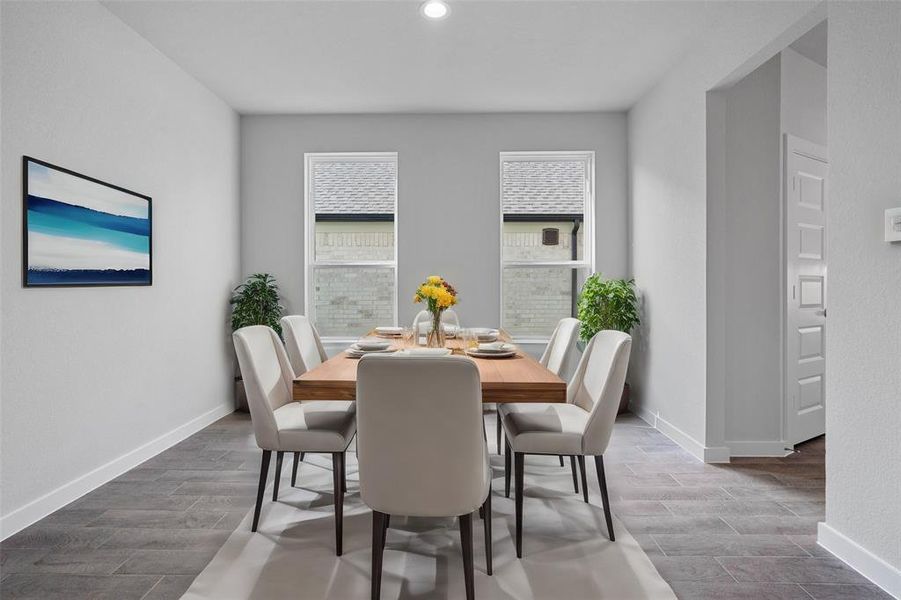 You and your guests will certainly dine in style in this amazing formal dining room! Featuring large windows with blinds, neutral paint, high ceilings, and tile flooring! Perfect space to entertain family and friends!