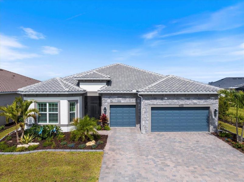 Front exterior of a new home in , Englewood, FL, highlighting curb appeal (Image 27).