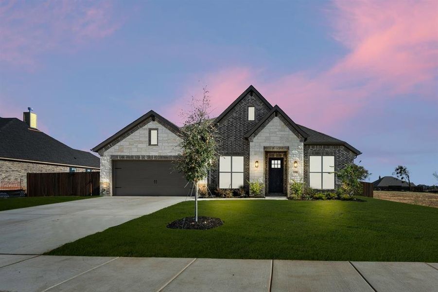 Front exterior of a new home in Coyote Crossing, Godley, TX, highlighting curb appeal (Image 1). Front exterior of a new home in Coyote Crossing, Godley, TX, highlighting curb appeal (Image 1).