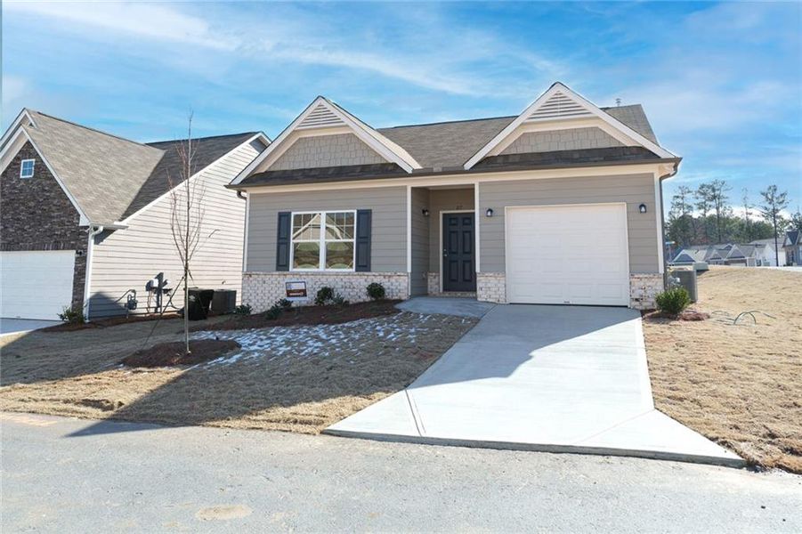 Front exterior of a new home in Villages at Cedar Hill, Dallas, GA, highlighting curb appeal (Image 2). Front exterior of a new home in Villages at Cedar Hill, Dallas, GA, highlighting curb appeal (Image 2).