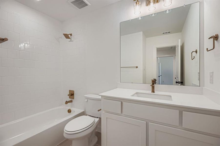 Full bath with shower / bathtub combination and vanity Full bath with shower / bathtub combination and vanity