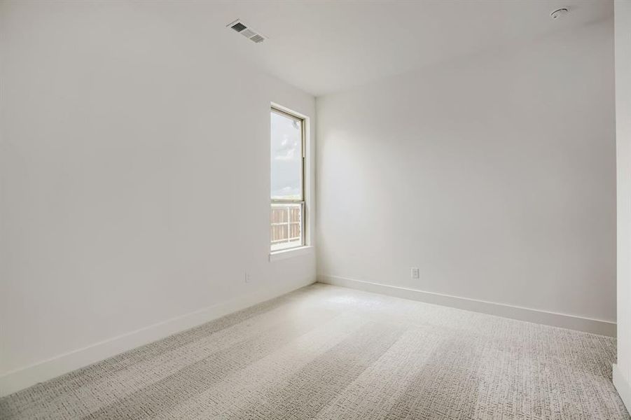 Spare room with carpet floors and baseboards