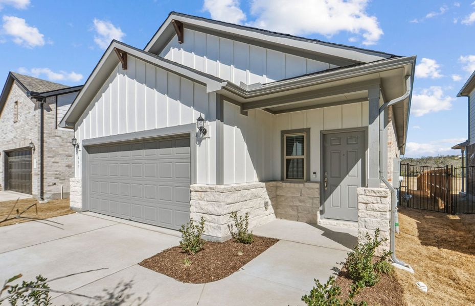 Front exterior of a new home in Saddleback at Santa Rita Ranch, Liberty Hill, TX, highlighting curb appeal (Image 18).