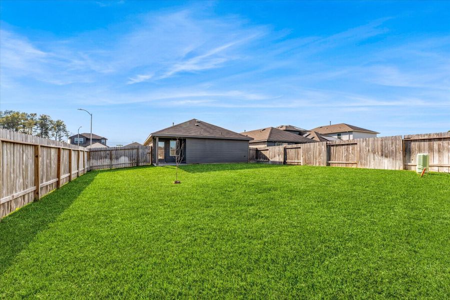 Exterior details and patio area of a home in , Spring (Image 3). Exterior details and patio area of a home in , Spring (Image 3).