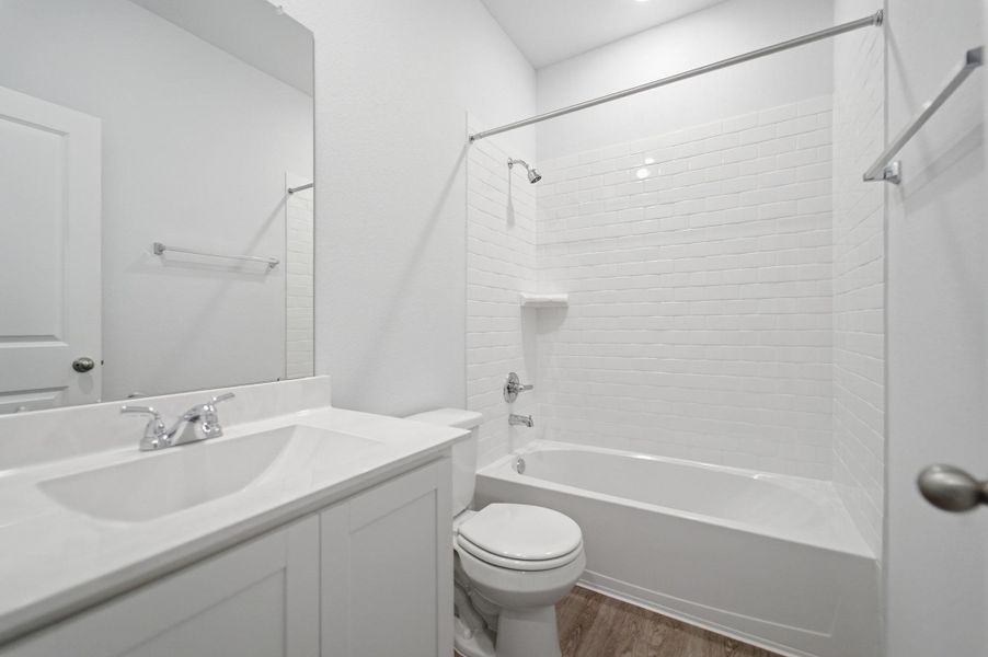 Furnished interior view inside a new home in The Pines at Seven Coves, Willis (Image 5).