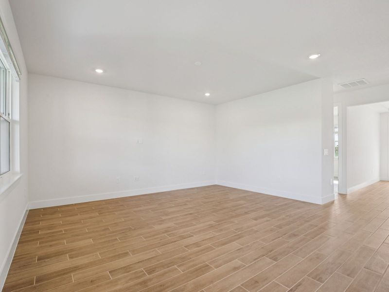 Spacious, unfurnished interior of a new home in Magnolia Bay - Reserve Series, Nokomis (Image 13).