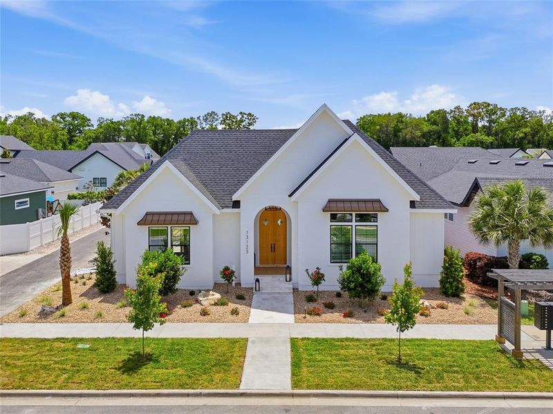 Front exterior of a new home in , Newberry, FL, highlighting curb appeal (Image 23).