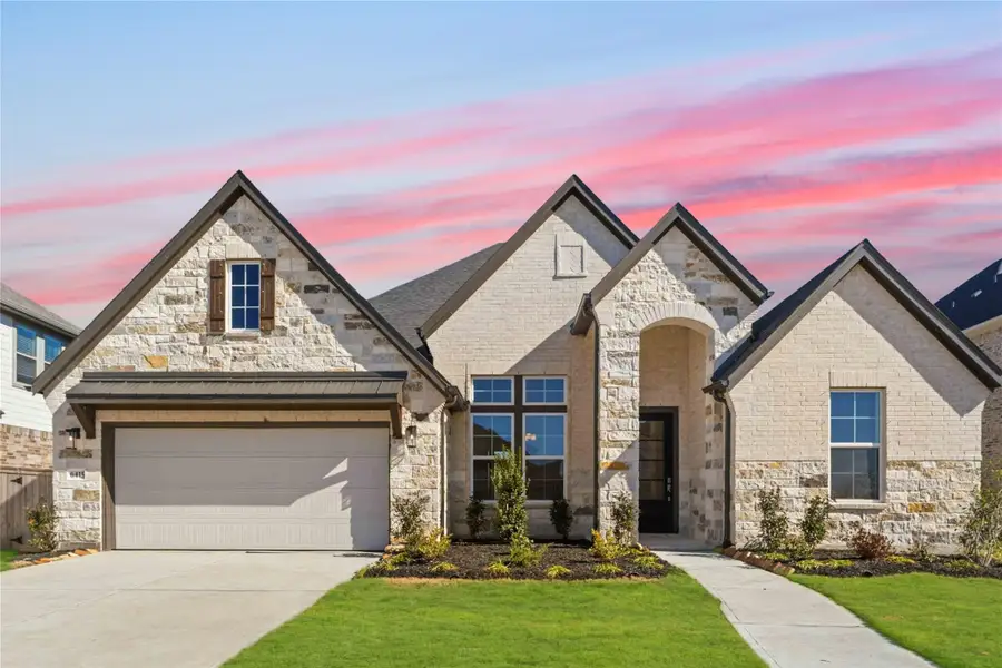 Front exterior of a new home in Valencia, Manvel, TX, highlighting curb appeal (Image 19).