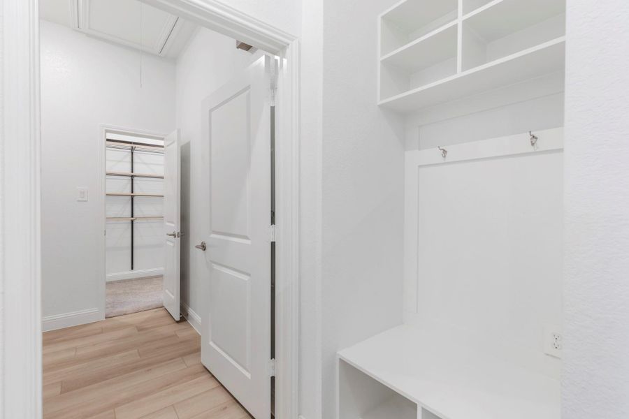 Conveniently located by the garage, the mudroom offers a practical drop zone for shoes, bags, and everyday essentials, helping keep the home organized and clutter-free.