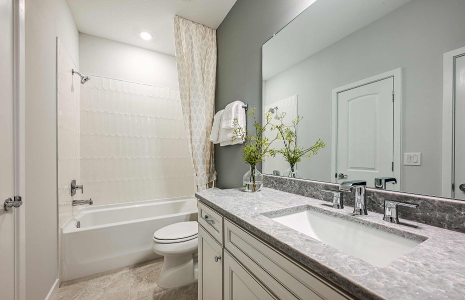 Representative furnished interior of a home built from the Mahogany Grand by Pulte Homes in Riversong, Parrish (Image 28).