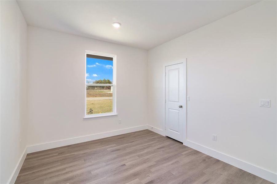 Spare room featuring light hardwood / wood-style flooring