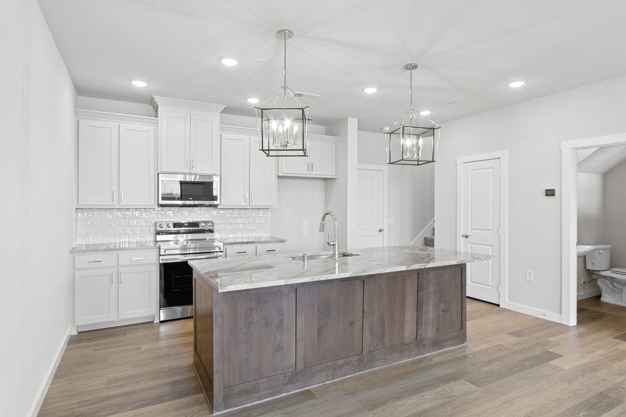 Furnished interior view inside a new home in Wildridge, Oak Point (Image 9).