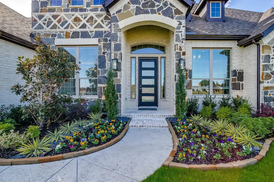 Exterior details and patio area of a home in Heritage, McLendon-Chisholm (Image 3).