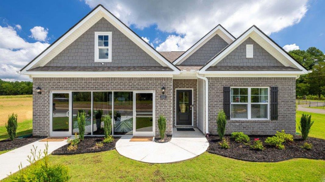 Front exterior of a new home in Sweet Briar, Ooltewah, TN, highlighting curb appeal (Image 19).