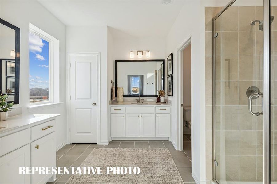 Spacious and bright owner's baths are waiting for you to call them home in Village on Main Street!  REPRESENTATIVE PHOTO