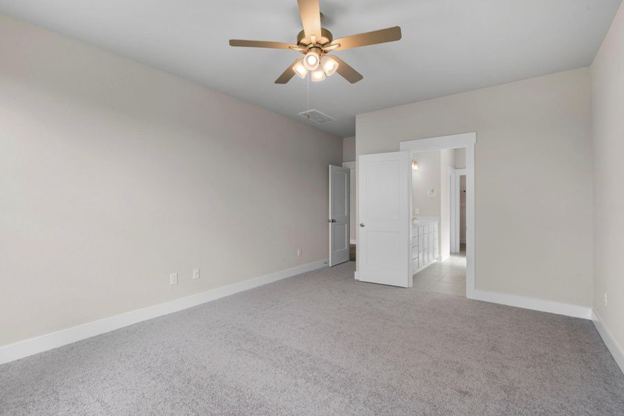 The spacious layout offers plenty of room for a plush king-sized bed, adorned with fluffy pillows and your favorite throws, inviting you to sink in and relax.