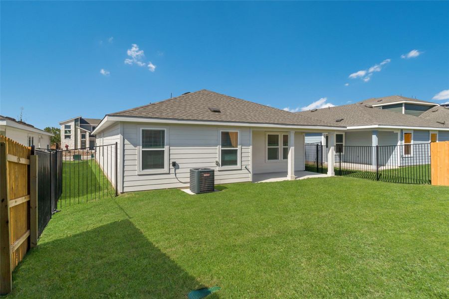 Exterior details and patio area of a home in Trails at Wildhorse, Austin (Image 4).