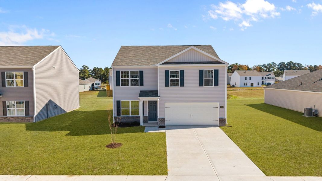 Front exterior of a new home in Madeline Farm, New Bern, NC, highlighting curb appeal (Image 2).