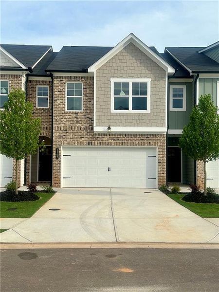 Front exterior of a new home in , Mableton, GA, highlighting curb appeal (Image 1). Front exterior of a new home in , Mableton, GA, highlighting curb appeal (Image 1).