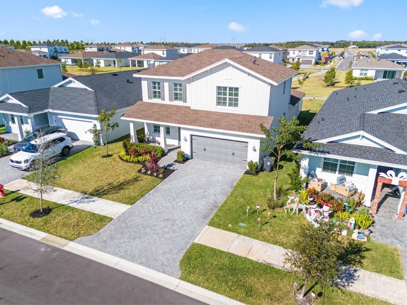 Front exterior of a new home in , Loxahatchee, FL, highlighting curb appeal (Image 27).