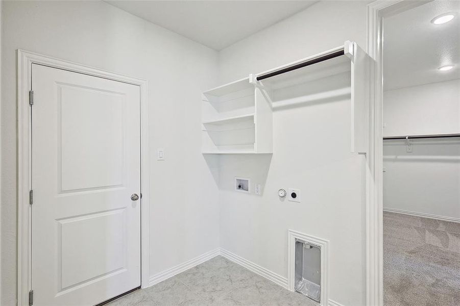 Laundry area featuring washer hookup, light carpet, hookup for an electric dryer, and hookup for a gas dryer