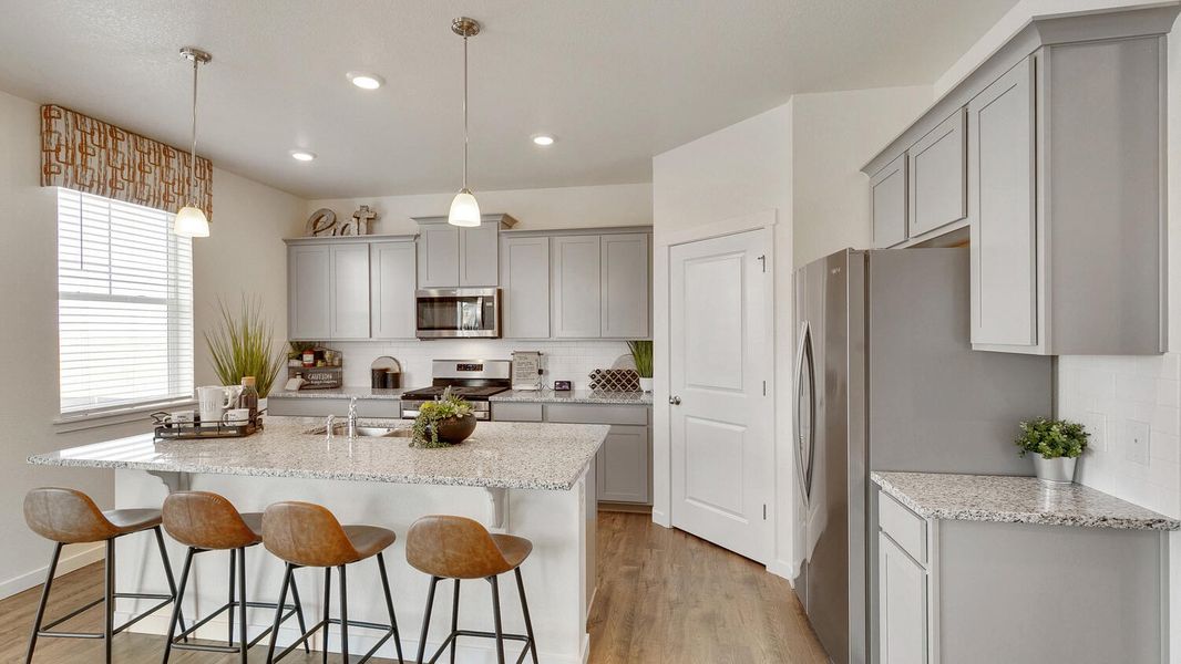 Representative furnished interior of a home built from the Holcombe by D.R. Horton in Settlers Crossing, Commerce City (Image 13).