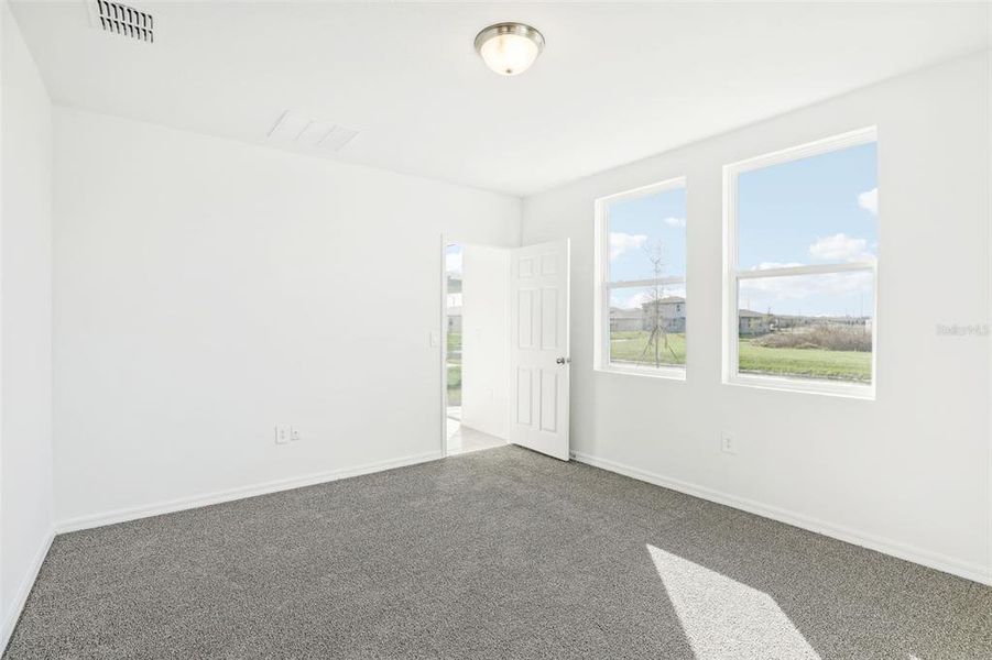 Spacious, unfurnished interior of a new home in Lake Deer Estates - Classic Series, Poinciana (Image 13).