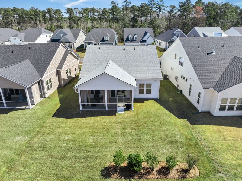 Exterior details and patio area of a home in Summerwind Crossing at Lakes of Cane Bay, Summerville (Image 30).