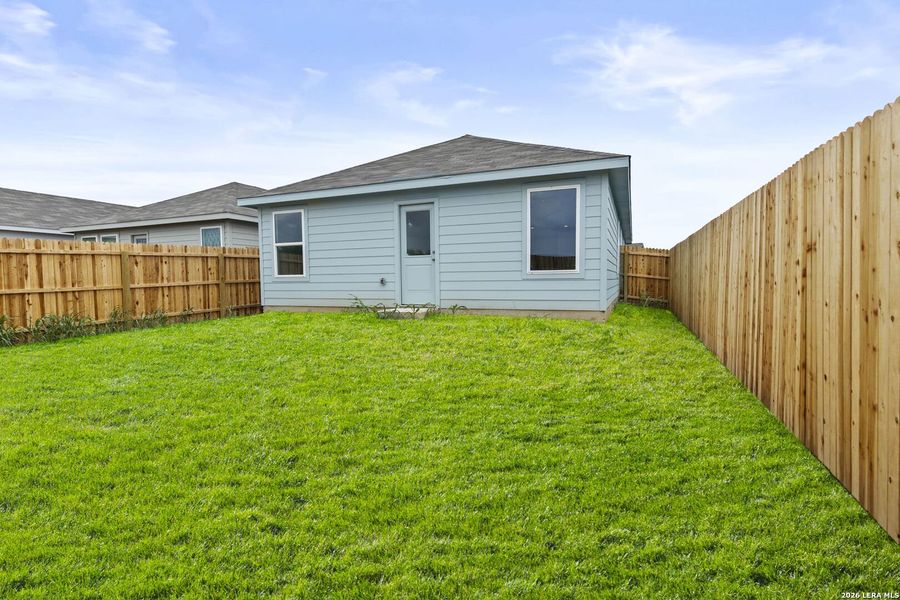 Exterior details and patio area of a home in Spring Grove, St. Hedwig (Image 2).
