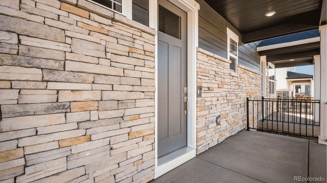 Exterior details and patio area of a home in Horizon Uptown, Aurora (Image 3). Exterior details and patio area of a home in Horizon Uptown, Aurora (Image 3).