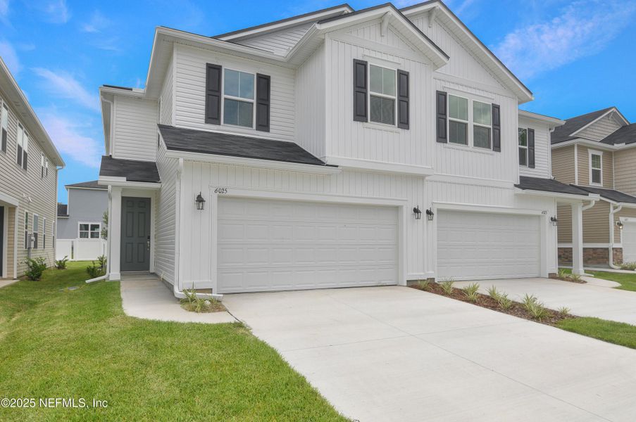 Front exterior of a new home in , Jacksonville, FL, highlighting curb appeal (Image 14).