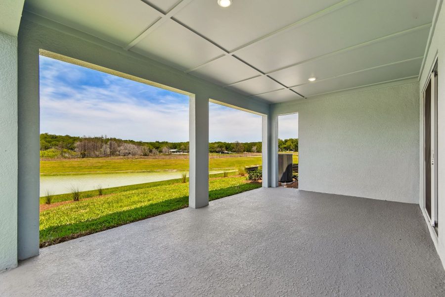 Exterior details and patio area of a home in Oakfield at Mount Dora Village Series, Mount Dora (Image 4).