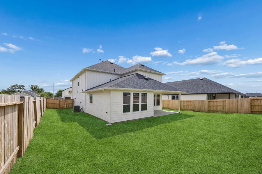 Exterior details and patio area of a home in Windcress, Cove (Image 4).