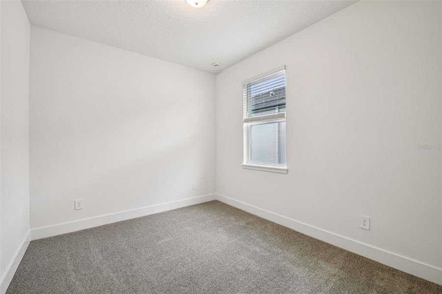 Spacious, unfurnished interior of a new home in Legends Preserve - Signature Series, Daytona Beach (Image 22).