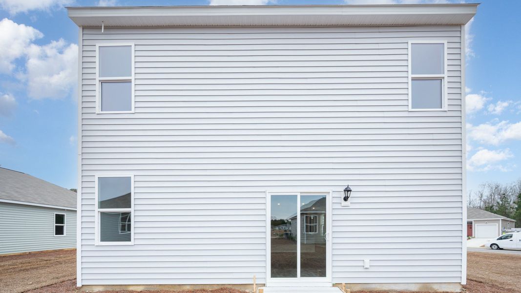 Exterior details and patio area of a home in Indigo Preserve, Leland (Image 2).