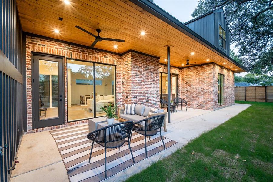 View of patio featuring an outdoor hangout area and ceiling fan