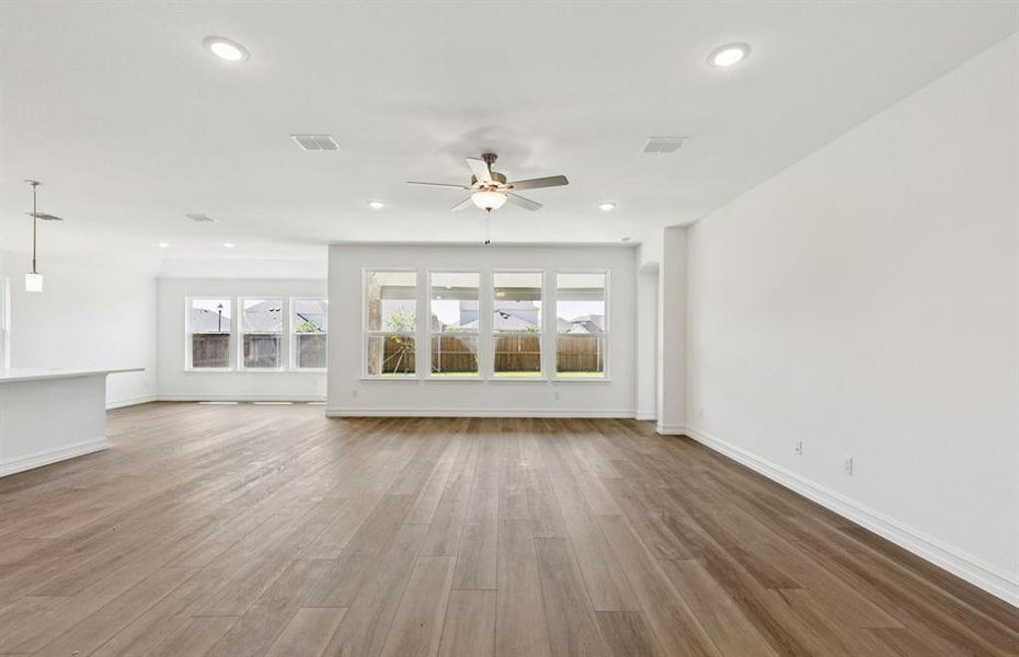 Expansive gathering room bathed in natural sunlight *Real home pictured Expansive gathering room bathed in natural sunlight *Real home pictured