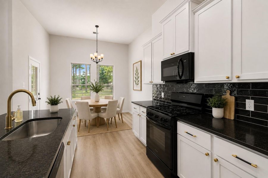 Gas stove and upgraded LVP flooring. *Virtually staged