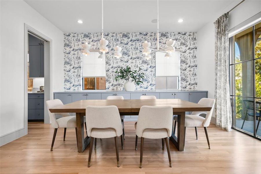 Dining space featuring a chandelier and light wood-type flooring