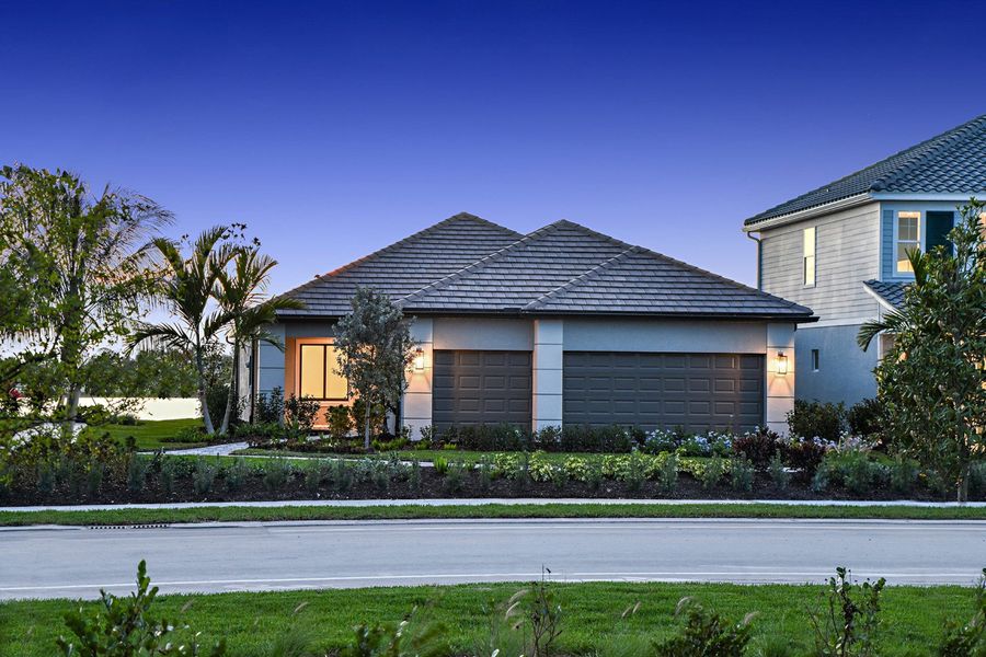 Representative exterior photo of a completed home built from the Meadow Brook by Neal Communities in SkySail, Naples, FL (Image 21).