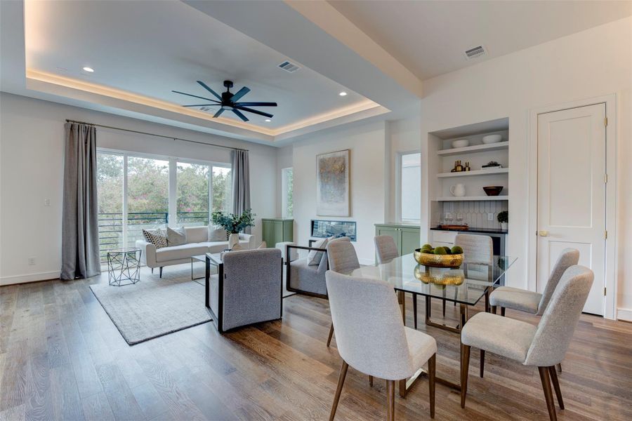 Tons of natural light floods the space, thanks to the balcony and expansive windows, creating a bright and inviting atmosphere.