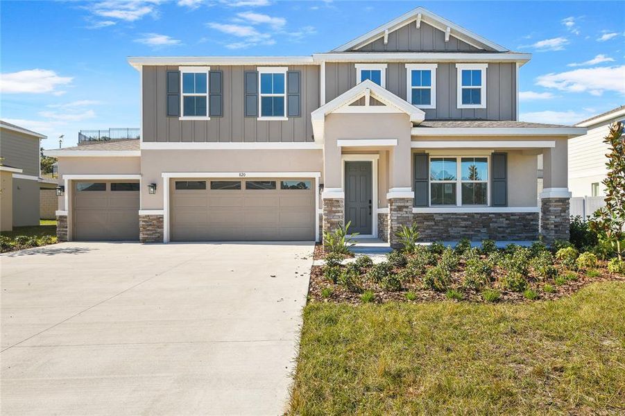 Front exterior of a new home in Seasons at Wekiva Ridge, Mount Dora, FL, highlighting curb appeal (Image 2). Front exterior of a new home in Seasons at Wekiva Ridge, Mount Dora, FL, highlighting curb appeal (Image 2).