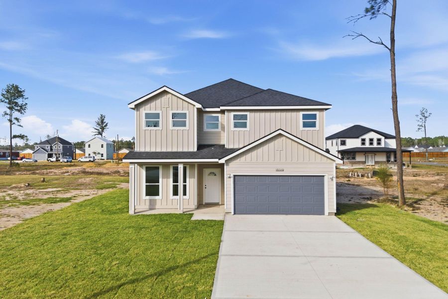 Front exterior of a new home in , Conroe, TX, highlighting curb appeal (Image 22).