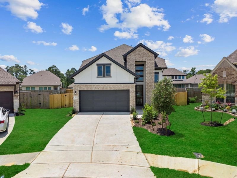 Front exterior of a new home in Escondido, Magnolia, TX, highlighting curb appeal (Image 21). Front exterior of a new home in Escondido, Magnolia, TX, highlighting curb appeal (Image 21).